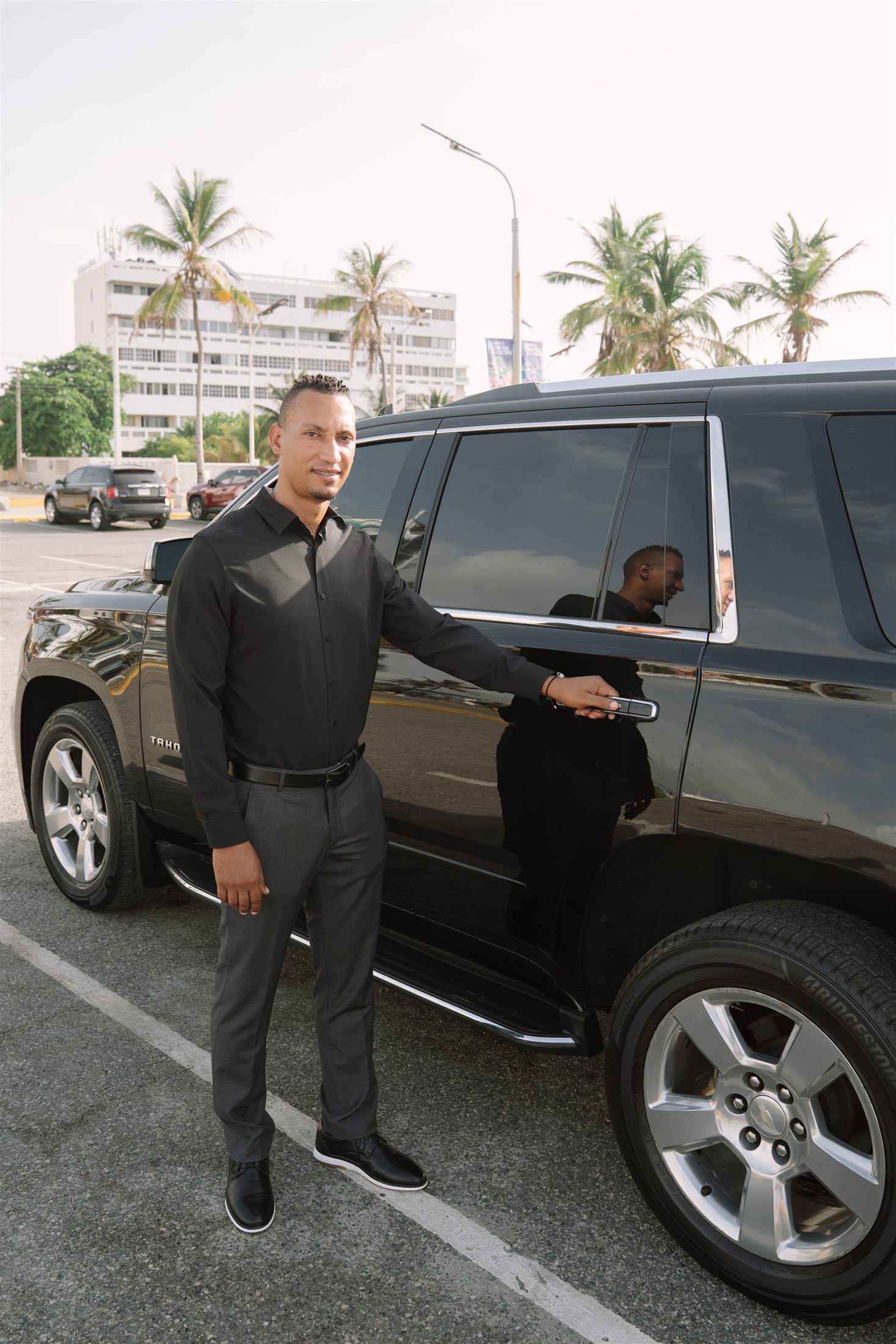 JMR chauffeur standing beside the executive vehicle